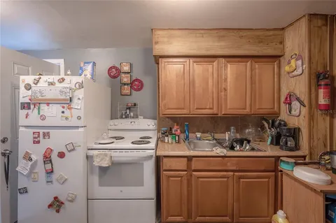 a utility room with sink dryer and washer