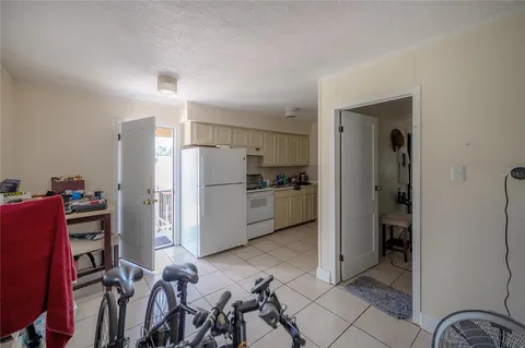an outdoor space with seating area and trees