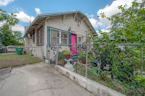 a kitchen with a refrigerator and a stove