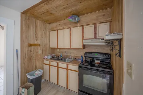 a living room with a couch and a wooden floor