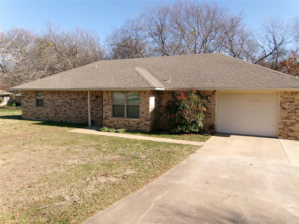 702 Jones Street Tom Bean, TX 75491 - Photo 1 of 1 a front view of a house with a yard