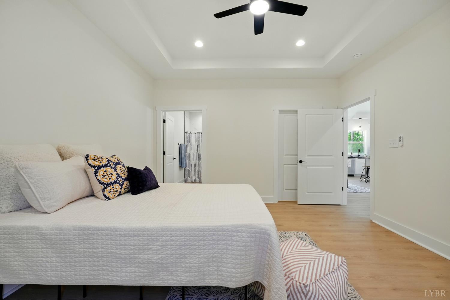3470 Double Bridges Road Spout Spring, VA 24593 - Photo 21 of 40 a bedroom with a bed and a ceiling fan