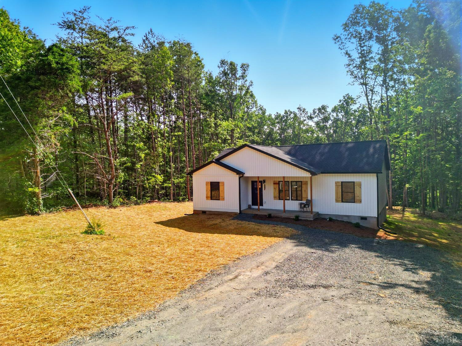 3470 Double Bridges Road Spout Spring, VA 24593 - Photo 3 of 40 a view of a house with a yard covered in snow
