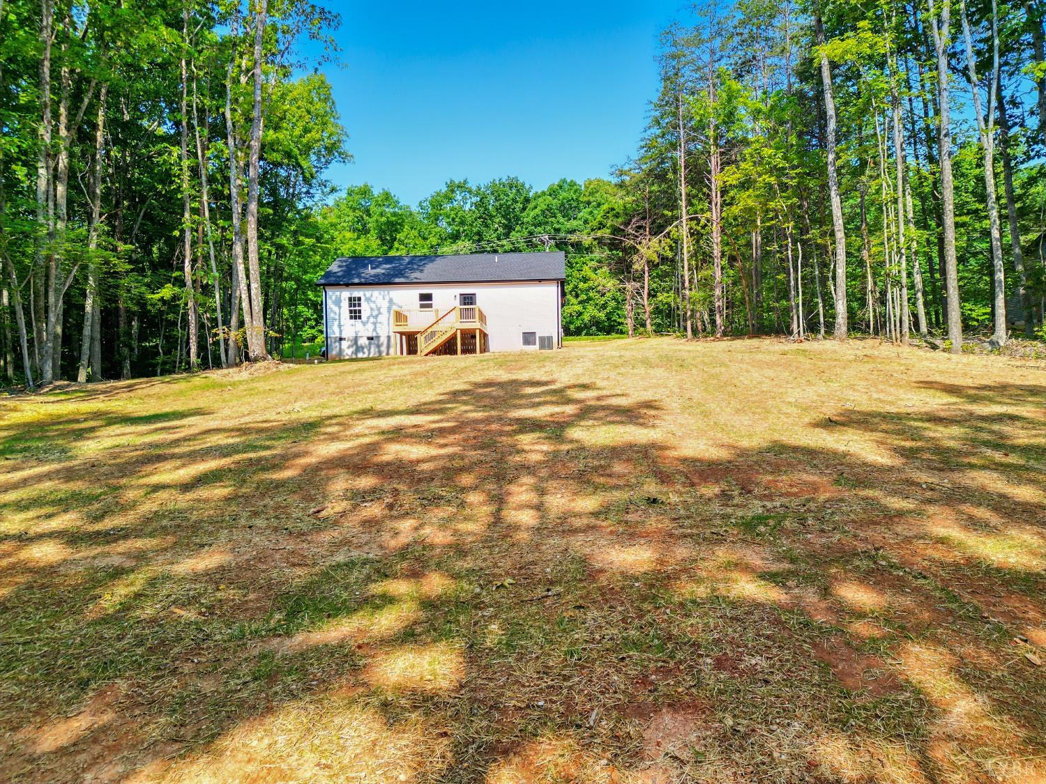 3470 Double Bridges Road Spout Spring, VA 24593 - Photo 33 of 40 a view of a house with a yard and tree s