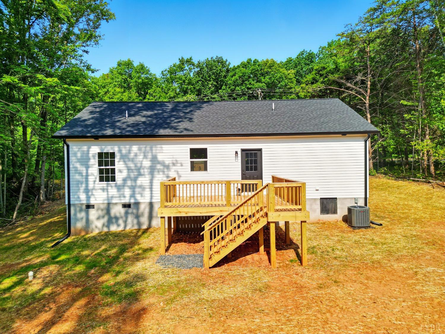 3470 Double Bridges Road Spout Spring, VA 24593 - Photo 34 of 40 a view of a house with a patio and a yard