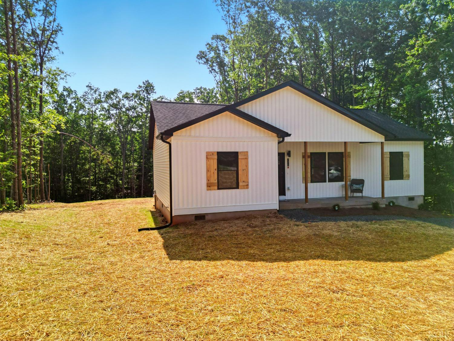 3470 Double Bridges Road Spout Spring, VA 24593 - Photo 4 of 40 a view of a house with a yard and large tree