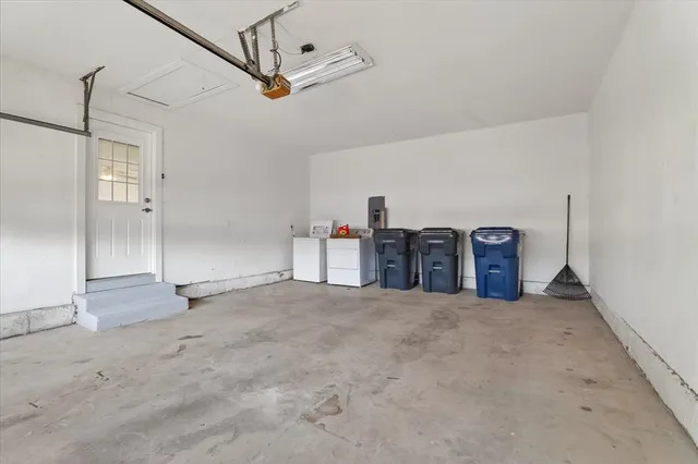 a view of a livingroom with an empty space and a projector