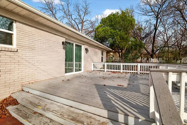 a view of a balcony and yard