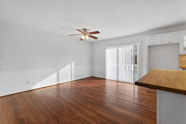 a view of livingroom with hardwood floor and ceiling fan