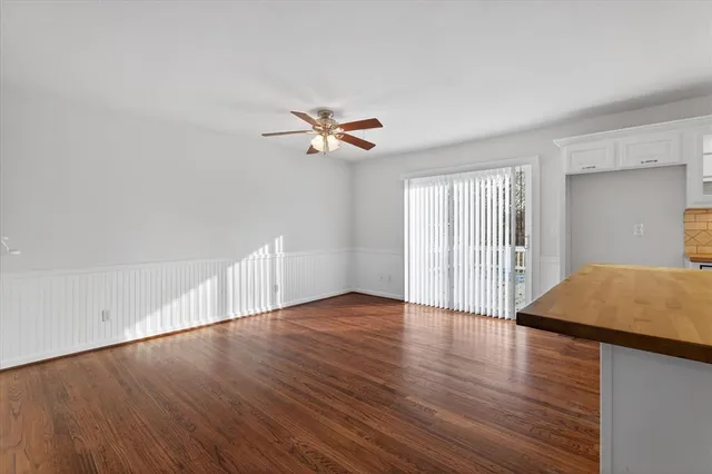a view of livingroom with hardwood floor and ceiling fan