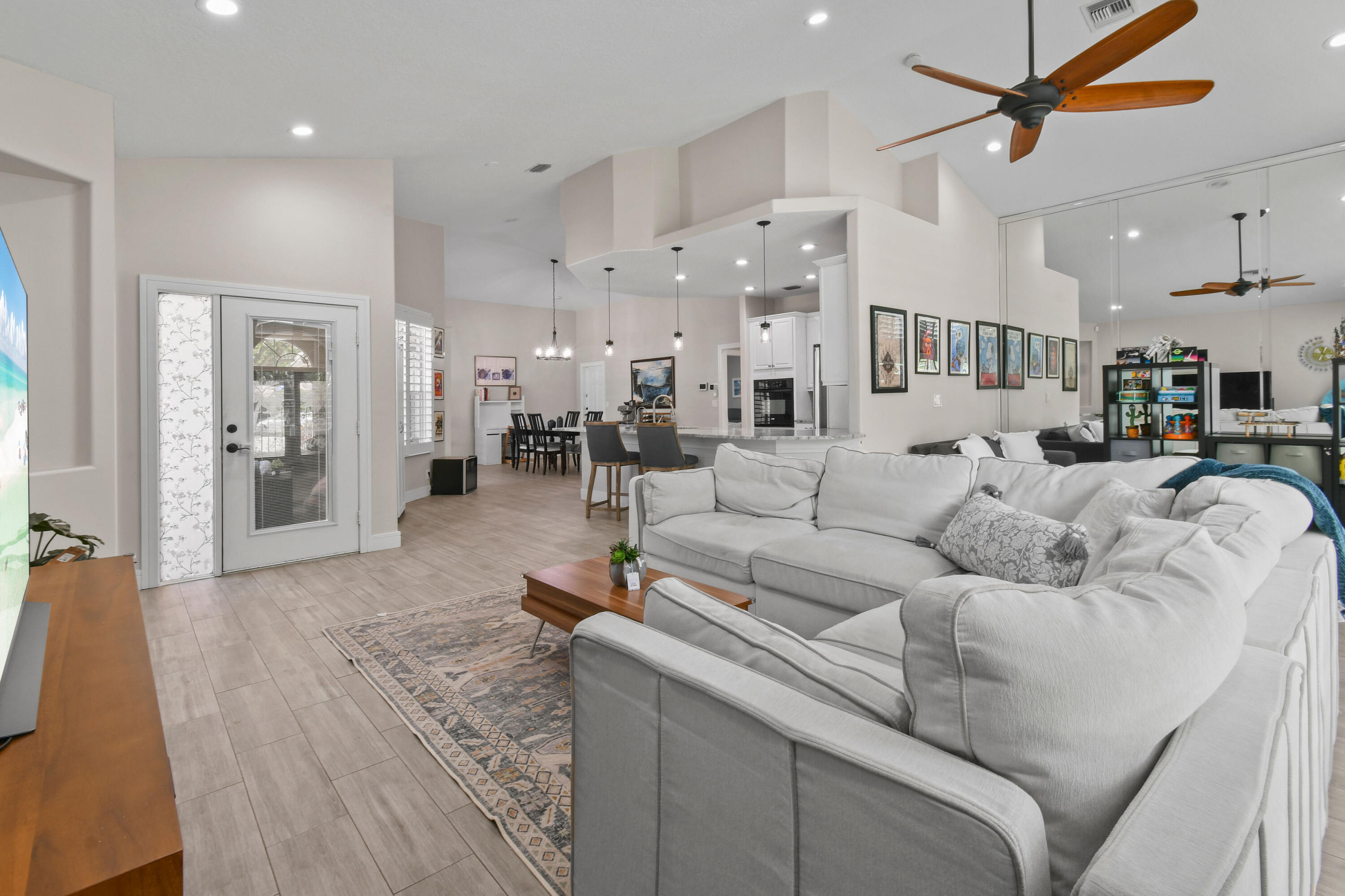 303 Hardwood Point Jupiter, FL 33458 - Photo 14 of 75 a living room with furniture and a dining table