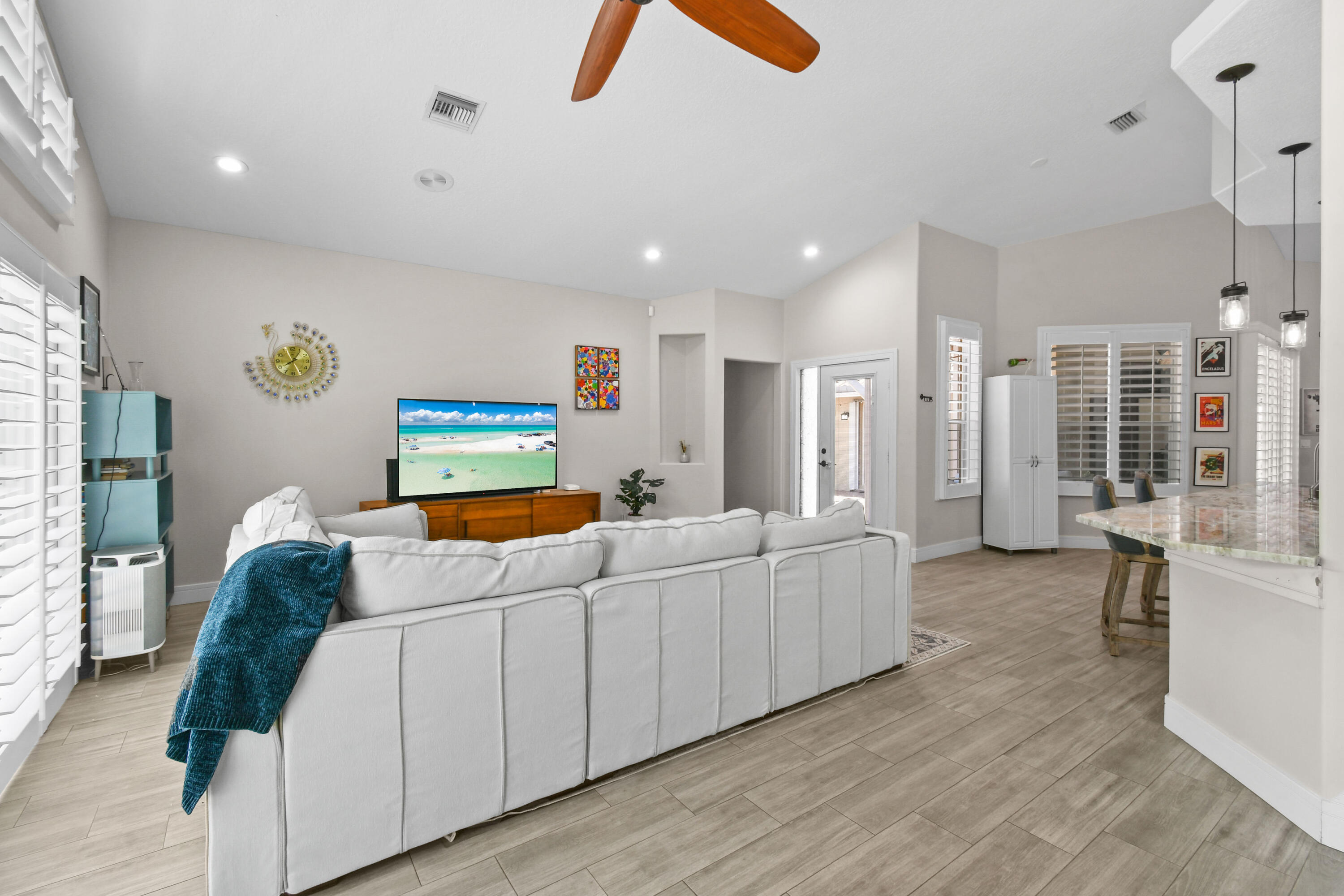 303 Hardwood Point Jupiter, FL 33458 - Photo 16 of 75 a living room with furniture and a flat screen tv