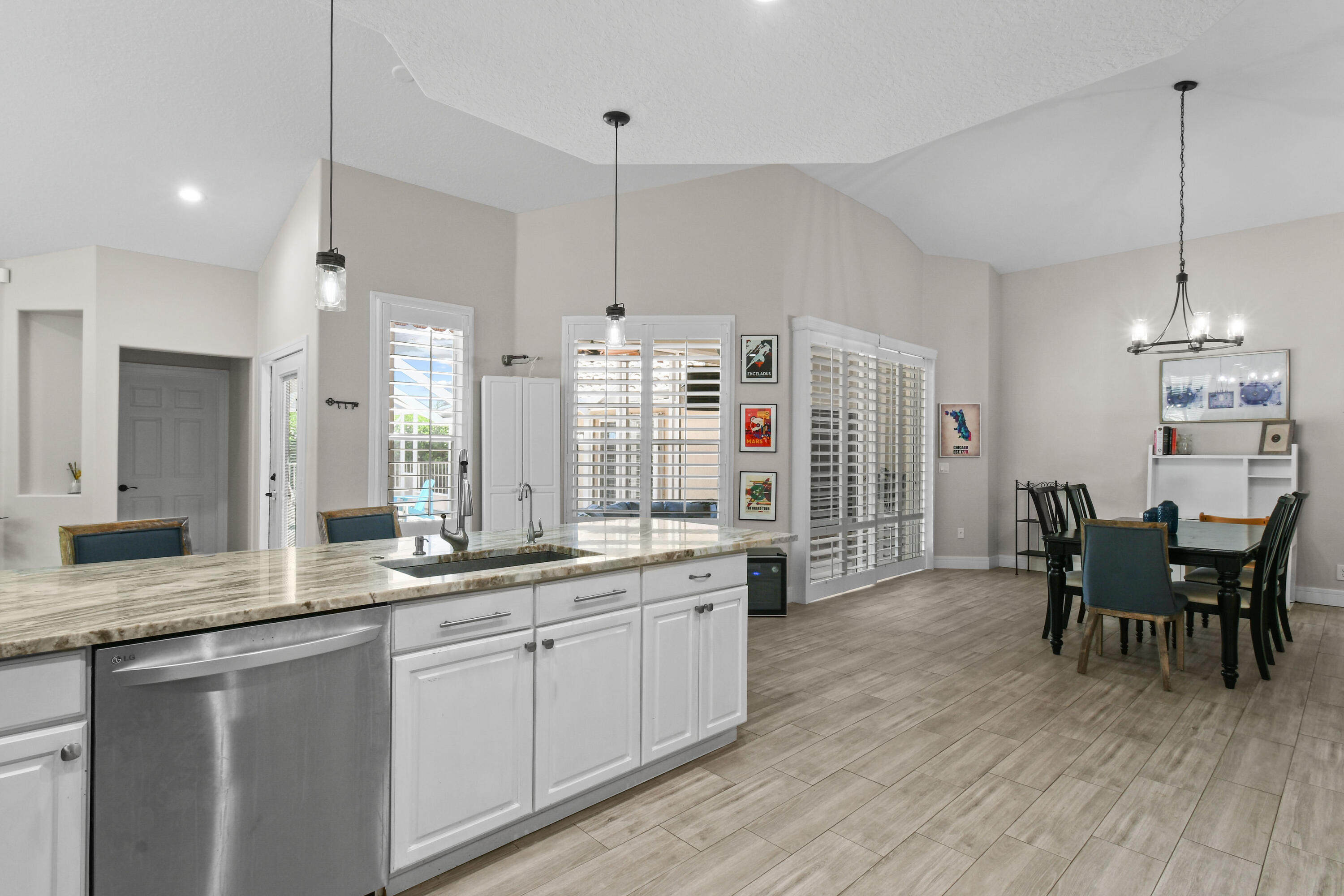 303 Hardwood Point Jupiter, FL 33458 - Photo 25 of 75 a large kitchen with a table and chairs