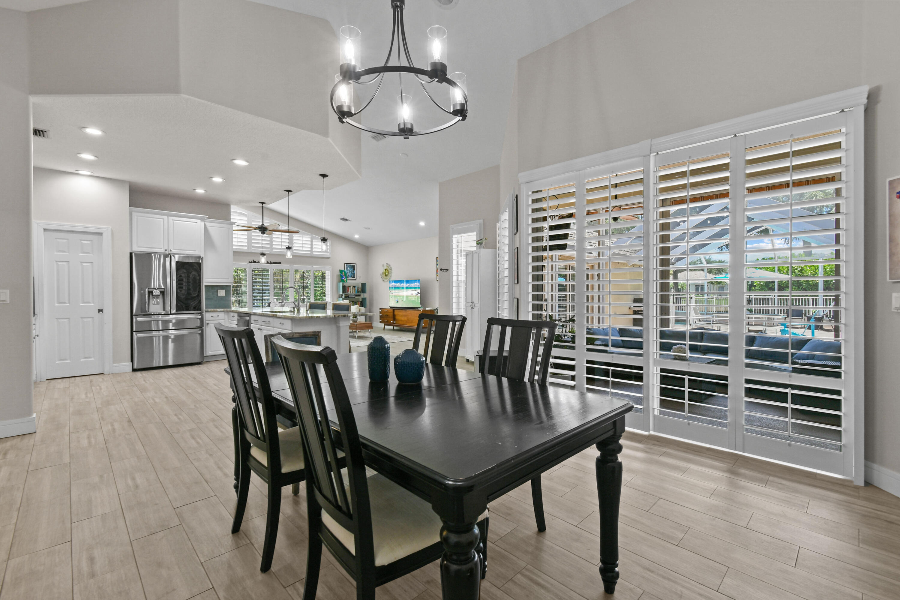 303 Hardwood Point Jupiter, FL 33458 - Photo 26 of 75 a view of a dining room with furniture window and wooden floor
