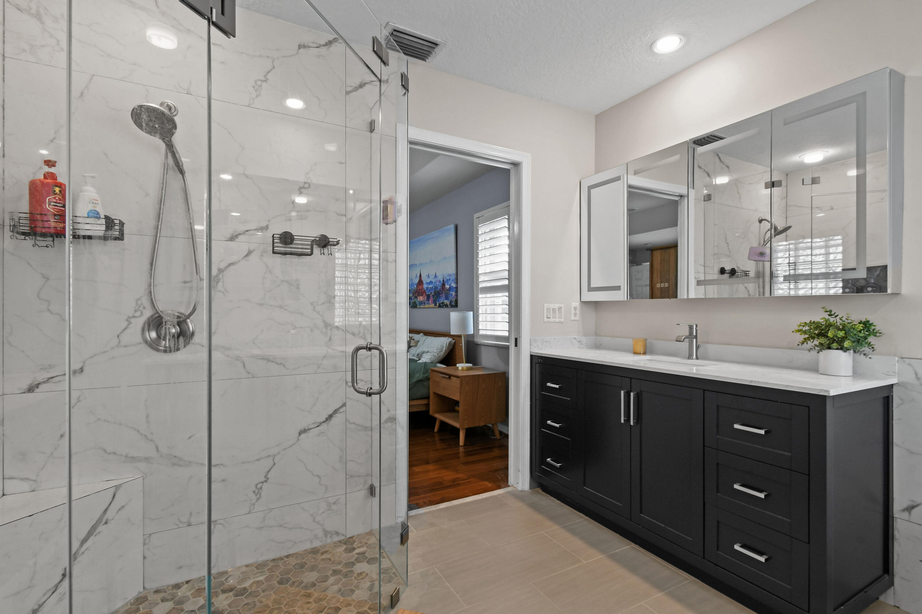 303 Hardwood Point Jupiter, FL 33458 - Photo 34 of 75 a bathroom with a double vanity sink mirror and shower