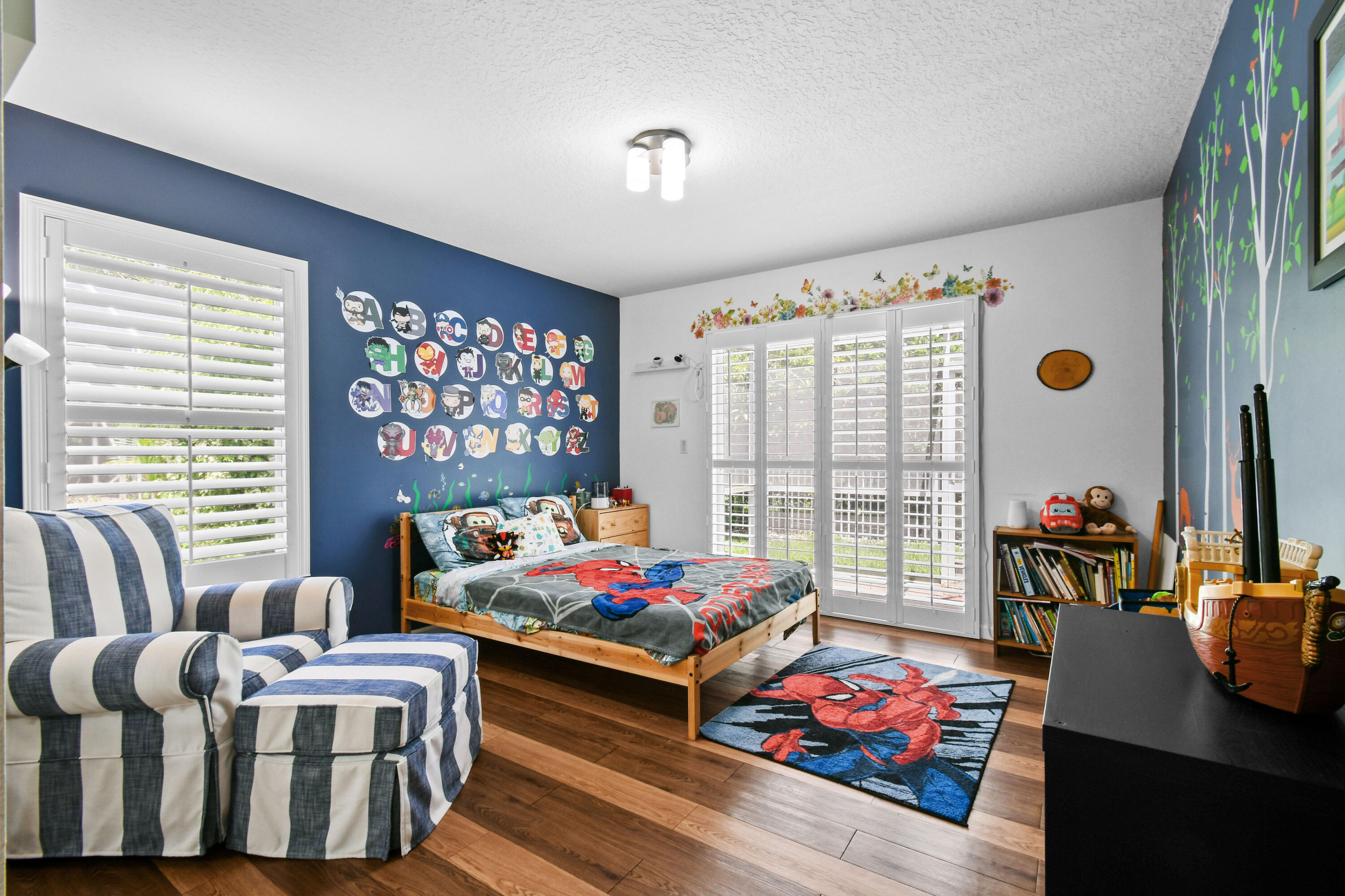 303 Hardwood Point Jupiter, FL 33458 - Photo 35 of 75 a bedroom with furniture and a large window