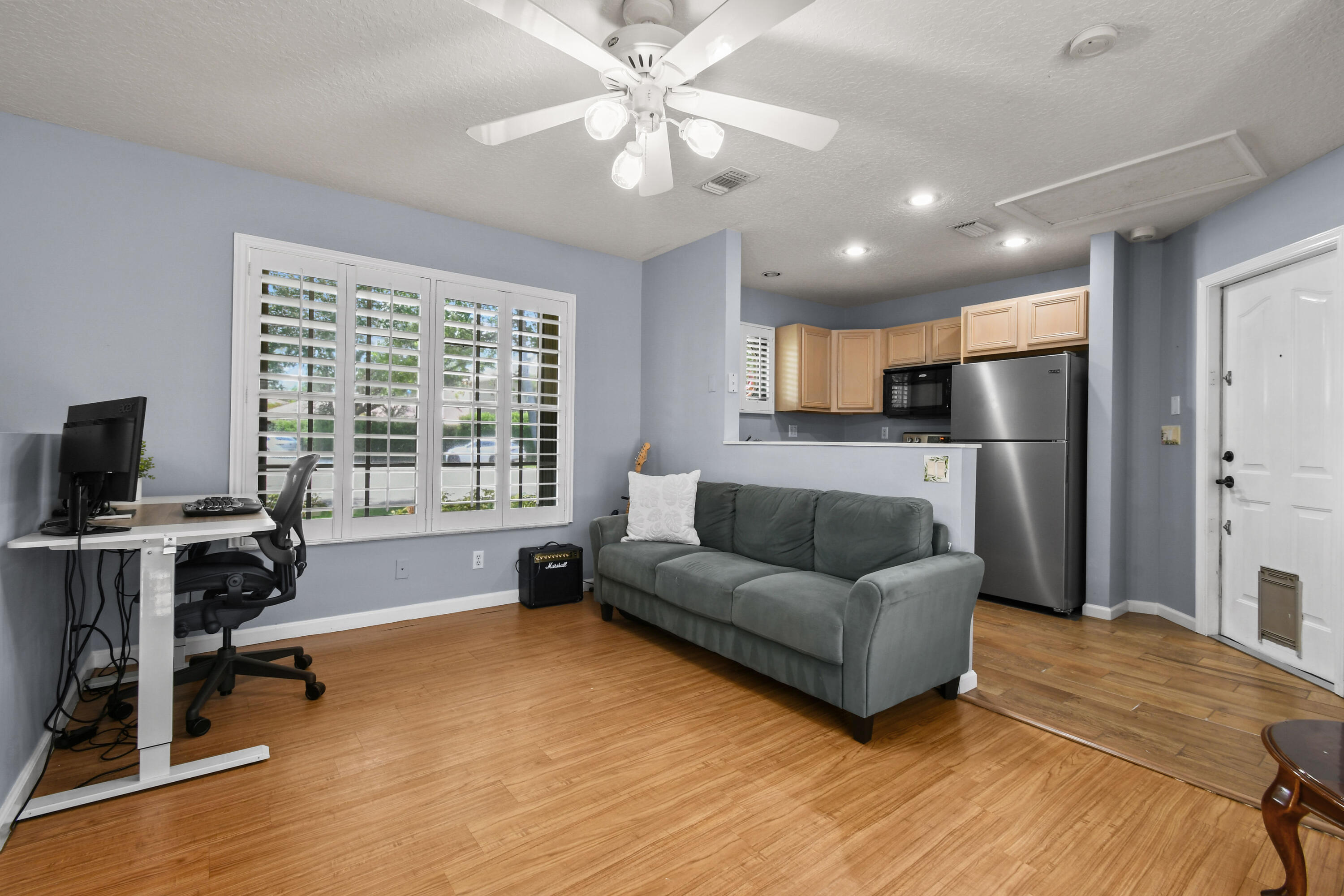303 Hardwood Point Jupiter, FL 33458 - Photo 47 of 75 a living room with furniture and a flat screen tv