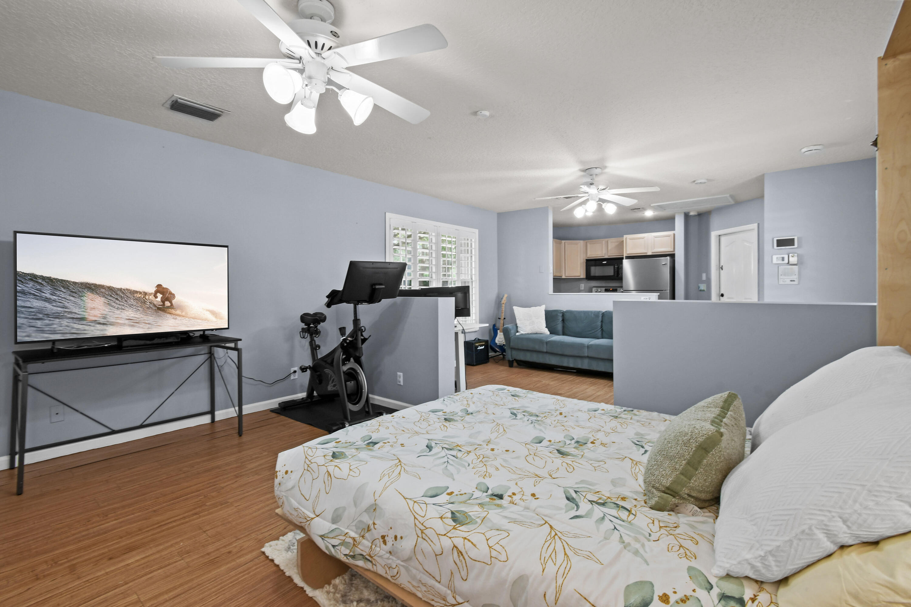 303 Hardwood Point Jupiter, FL 33458 - Photo 49 of 75 a bed room with a bed furniture and a flat screen tv