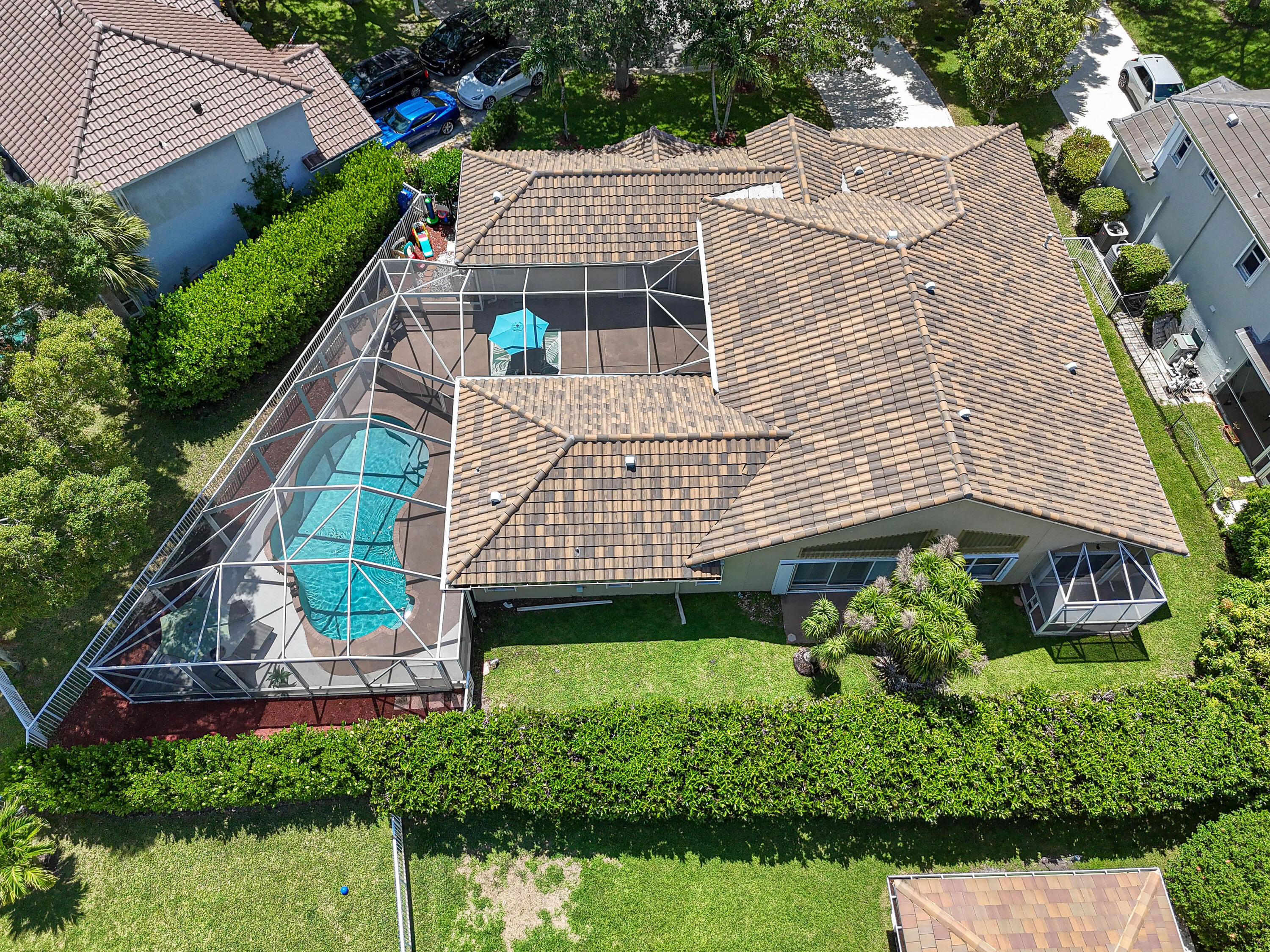 303 Hardwood Point Jupiter, FL 33458 - Photo 67 of 75 a aerial view of a house with a yard and potted plants