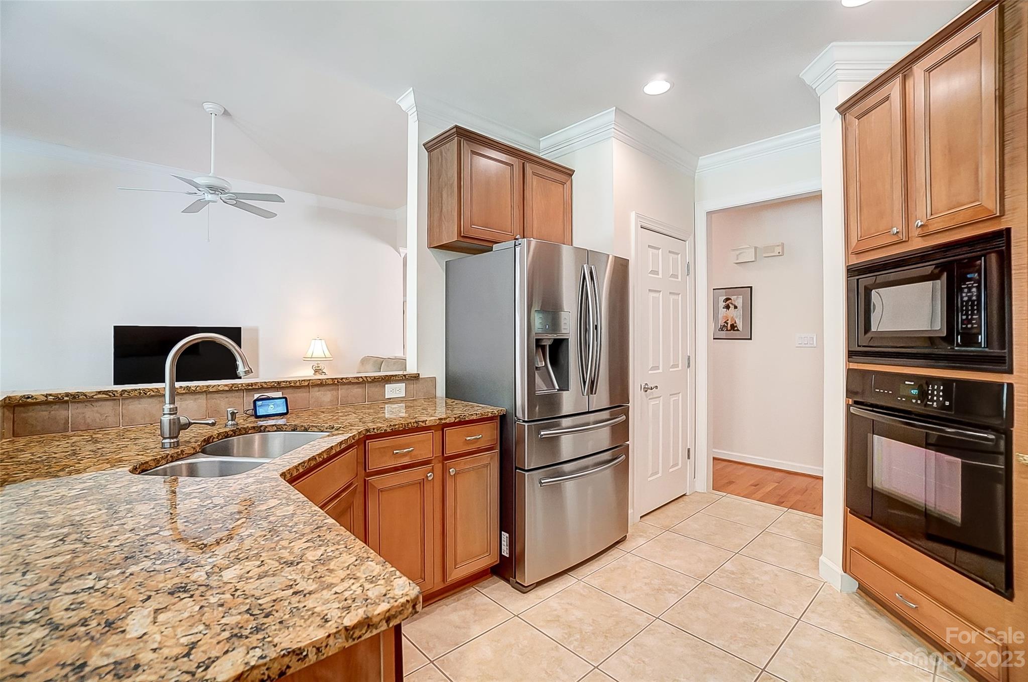 203 Shoreline Parkway Tega Cay, SC 29708 - Photo 16 of 42 a kitchen with stainless steel appliances granite countertop a refrigerator sink and stove