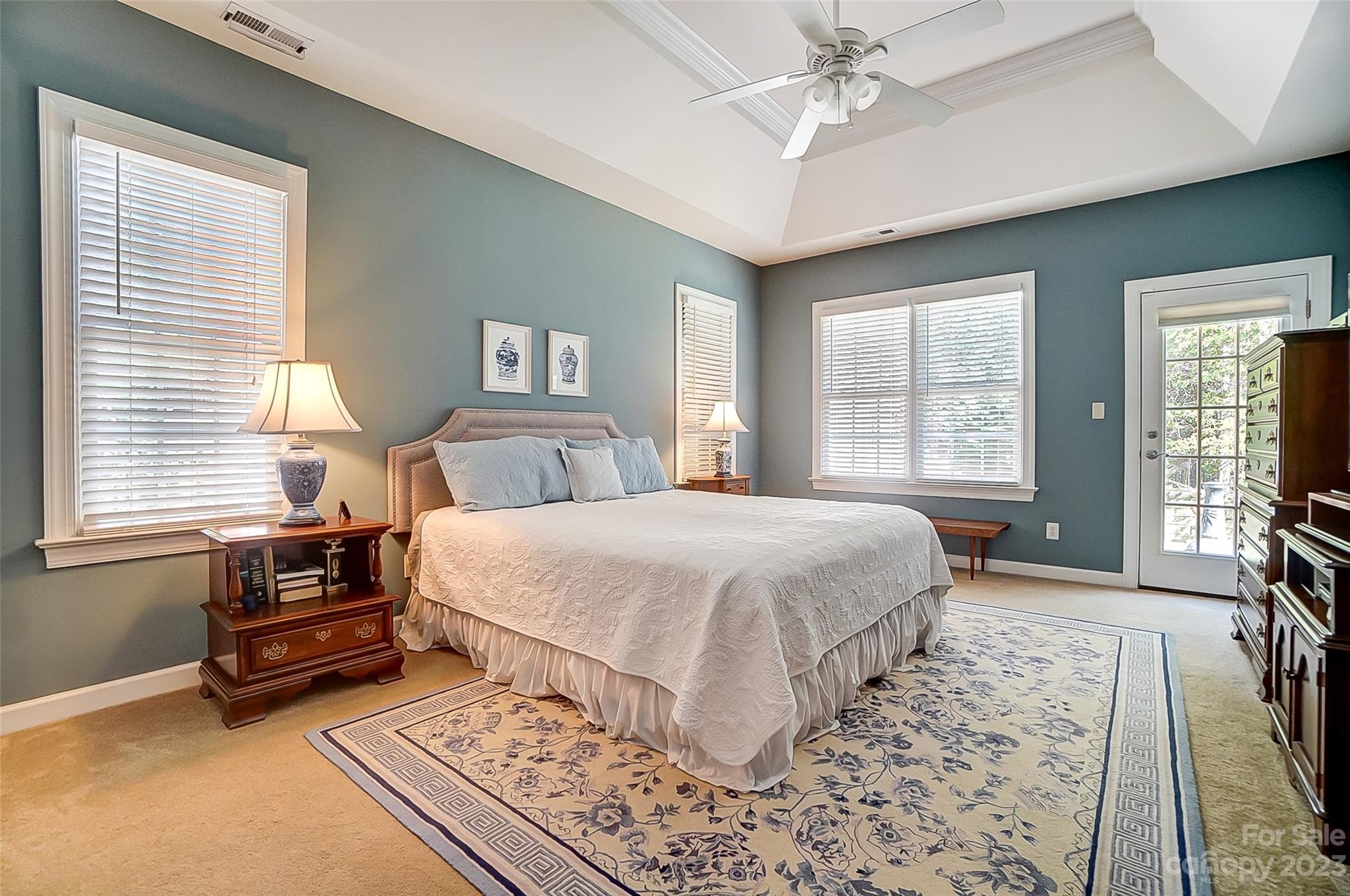 203 Shoreline Parkway Tega Cay, SC 29708 - Photo 24 of 42 a bedroom with a bed and wooden floor