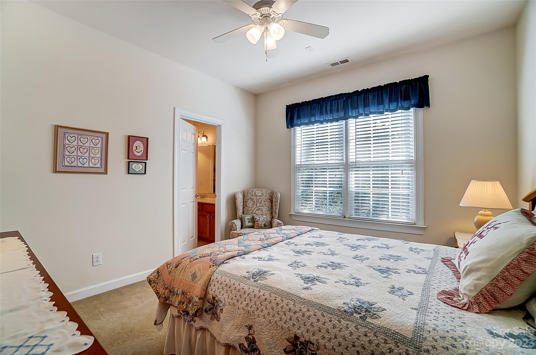 203 Shoreline Parkway Tega Cay, SC 29708 - Photo 30 of 42 a bedroom with a large bed and a window