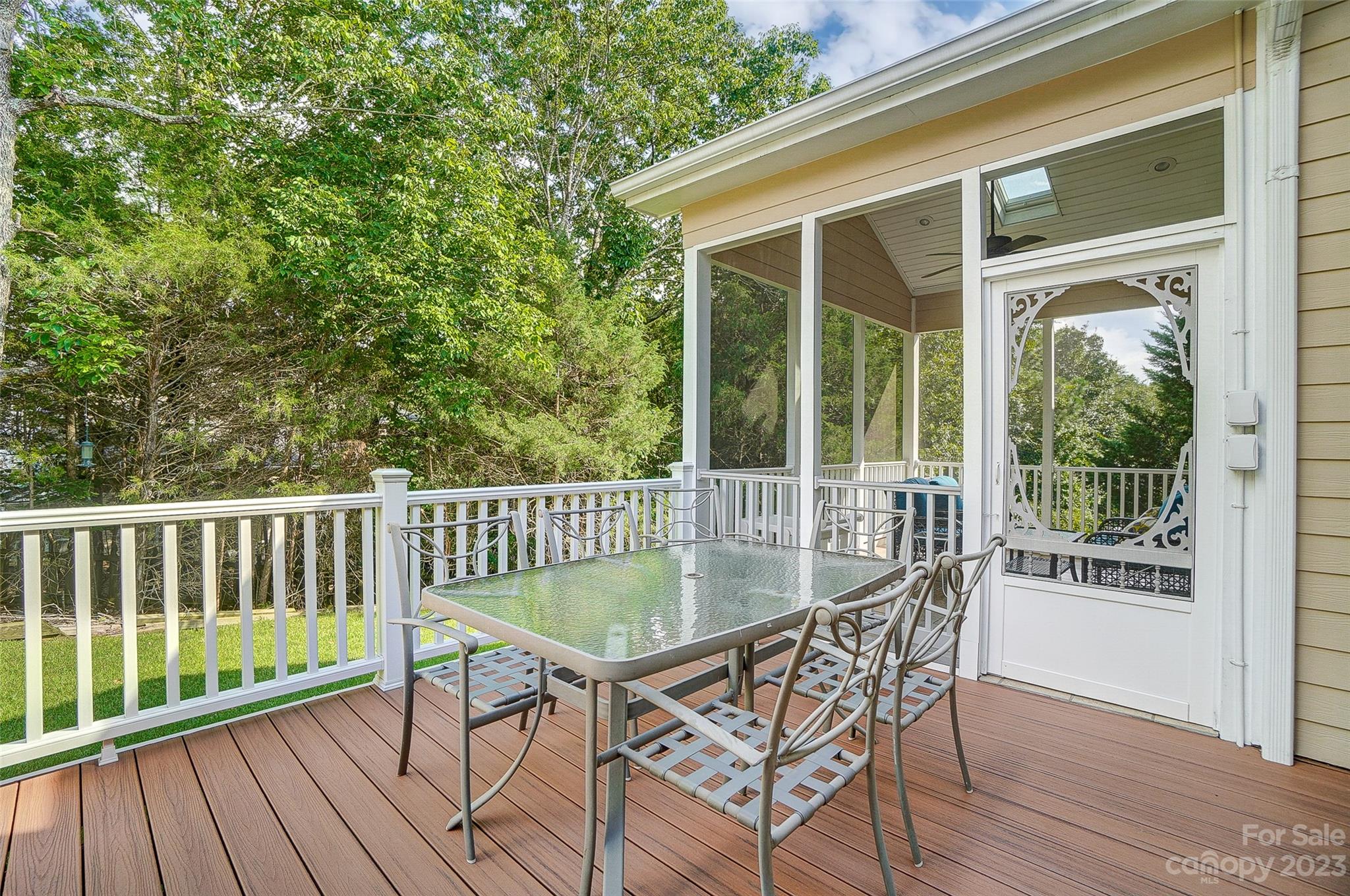 203 Shoreline Parkway Tega Cay, SC 29708 - Photo 38 of 42 a view of a chair and table on the deck