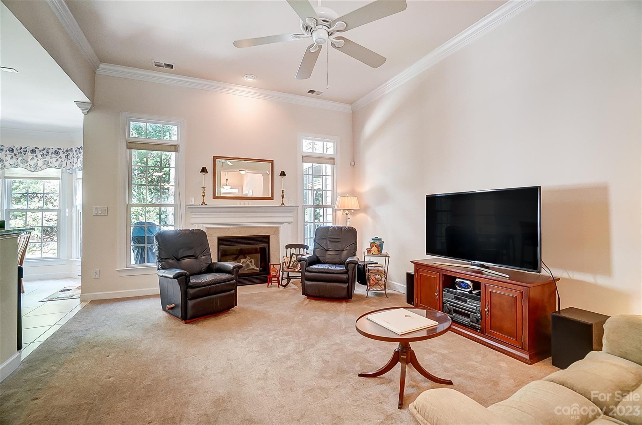 203 Shoreline Parkway Tega Cay, SC 29708 - Photo 9 of 42 a living room with furniture and a flat screen tv