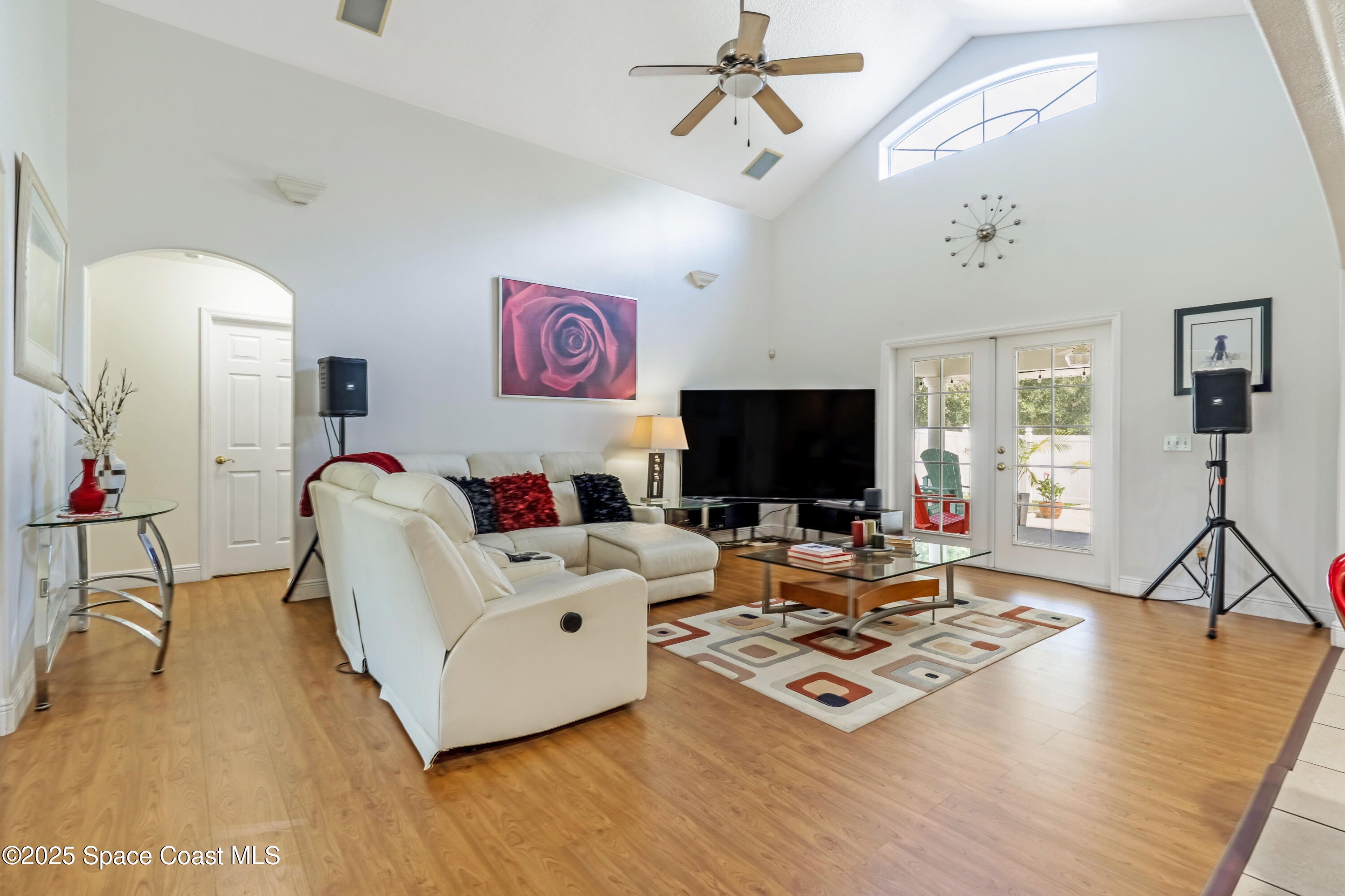 4985 Hamlin Circle Mims, FL 32754 - Photo 15 of 39 a living room with furniture and a flat screen tv
