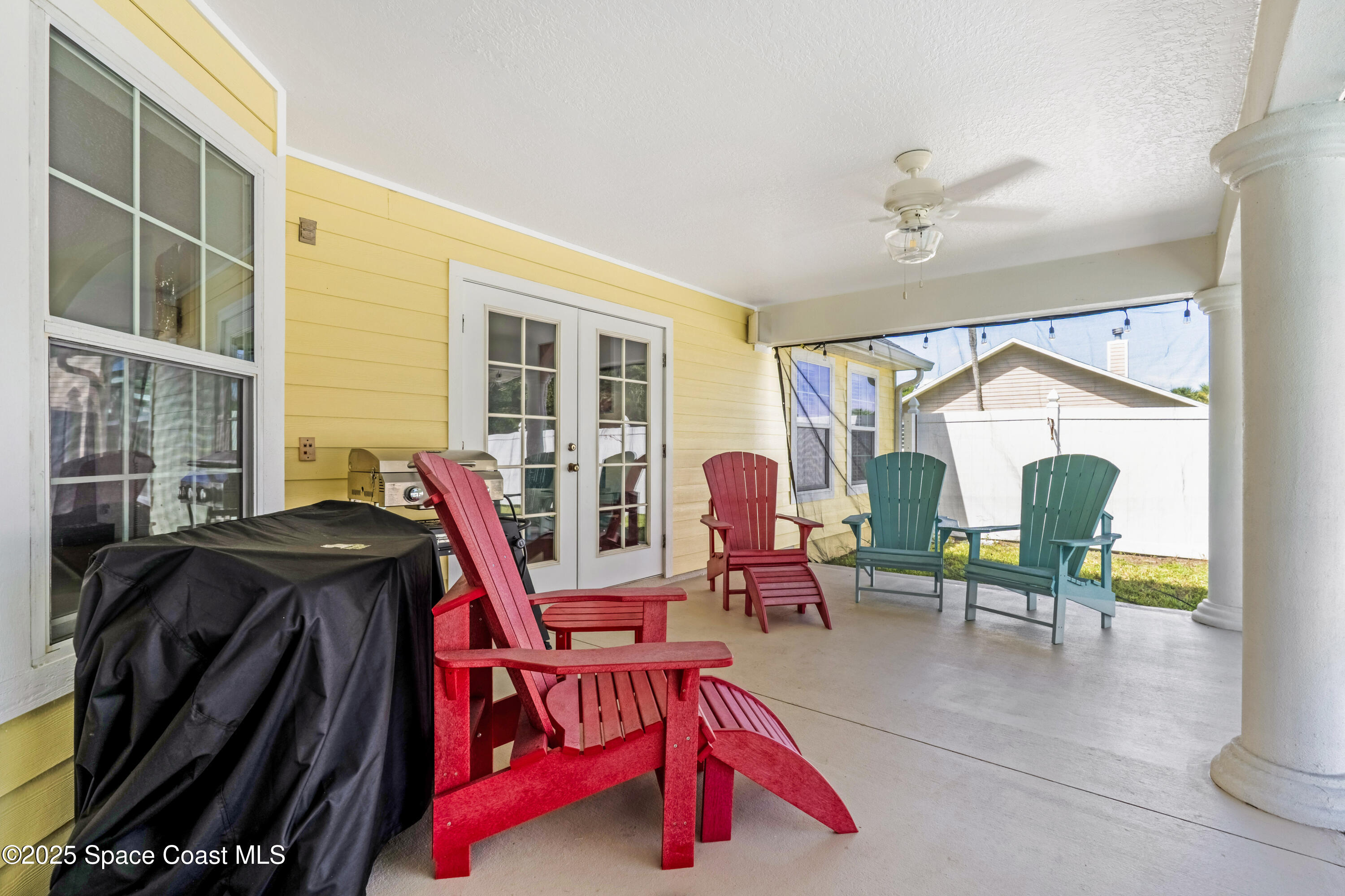 4985 Hamlin Circle Mims, FL 32754 - Photo 33 of 39 a living room filled with furniture and a chandelier