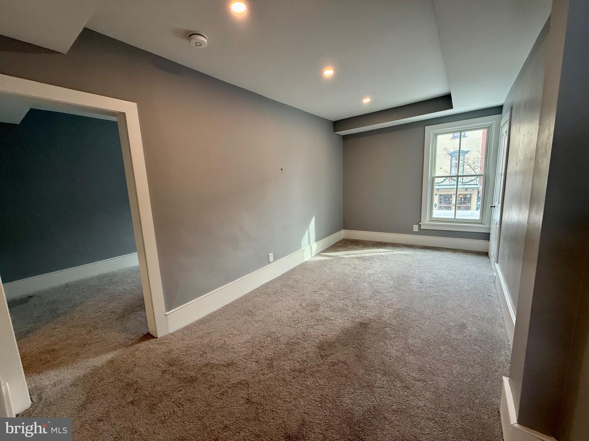 25 West State Street Doylestown, PA 18901 - Photo 5 of 9 a view of an empty room with a window