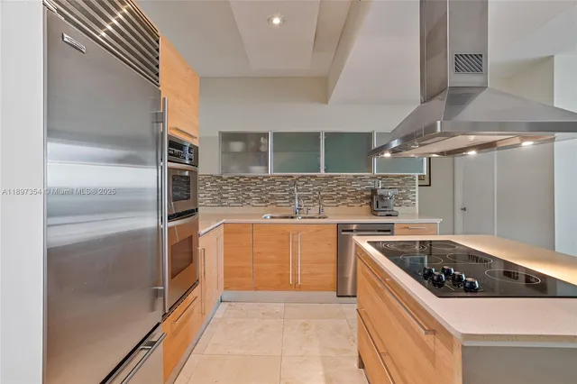 a kitchen with a stove and a refrigerator