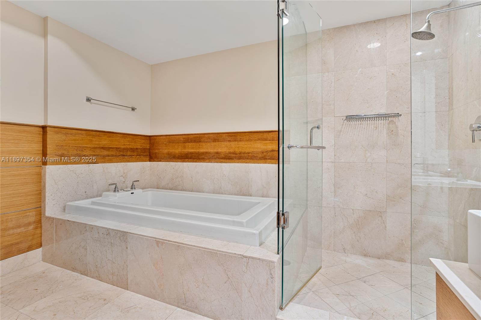 218 Southeast 14th Street, Unit 2105 Miami, FL 33131 - Photo 18 of 36 a bathroom with a bathtub and a shower