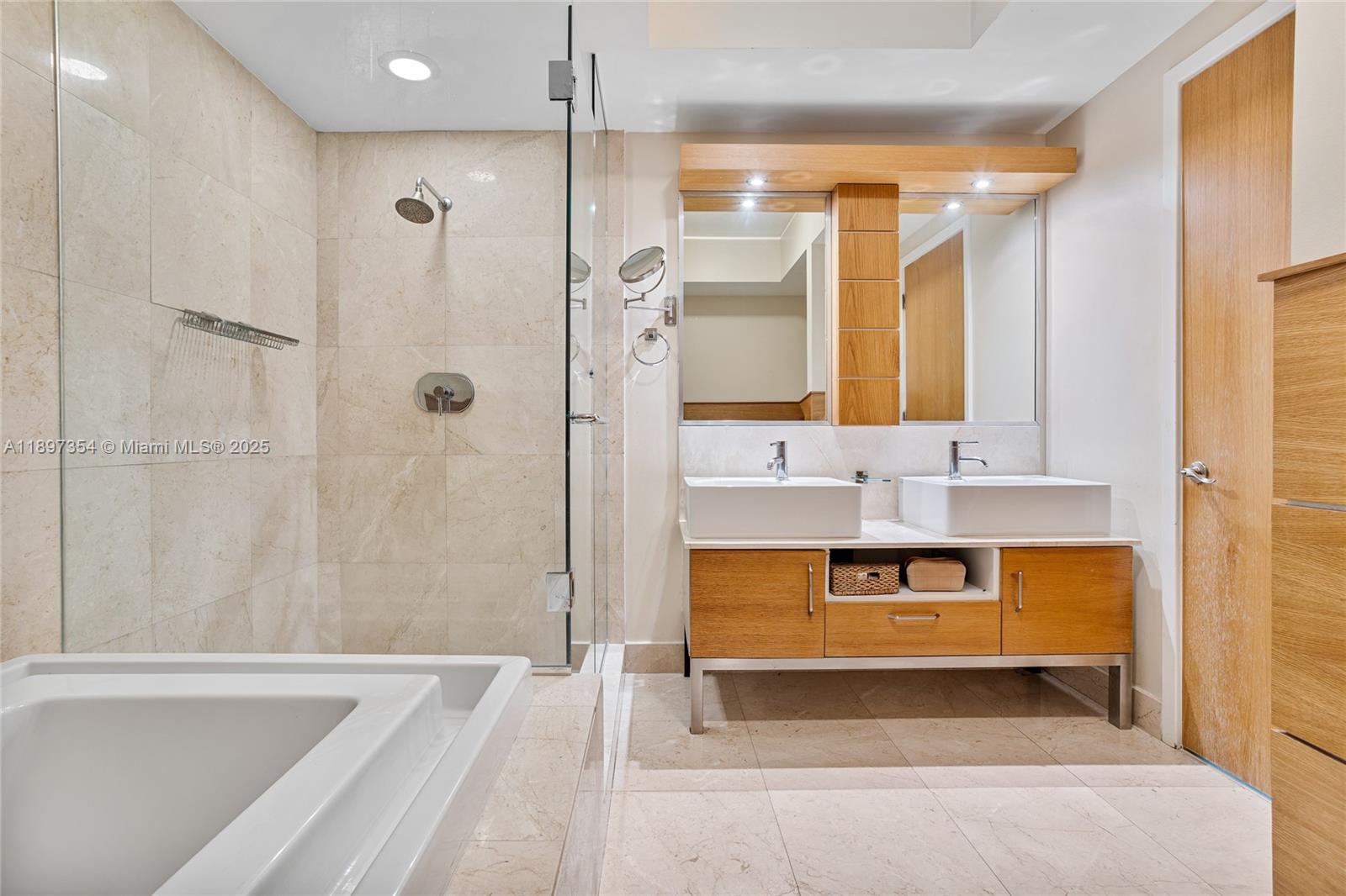 218 Southeast 14th Street, Unit 2105 Miami, FL 33131 - Photo 19 of 36 a bathroom with a tub sink shower and mirror