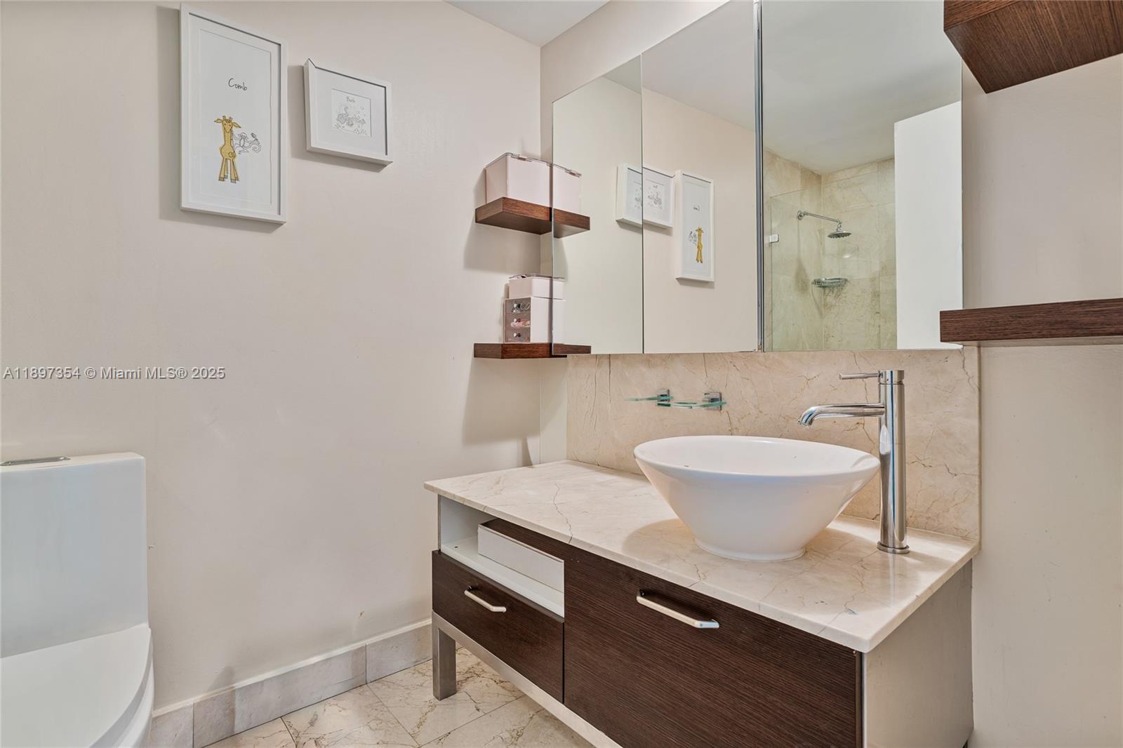 218 Southeast 14th Street, Unit 2105 Miami, FL 33131 - Photo 22 of 36 a bathroom with a sink toilet a mirror and shower