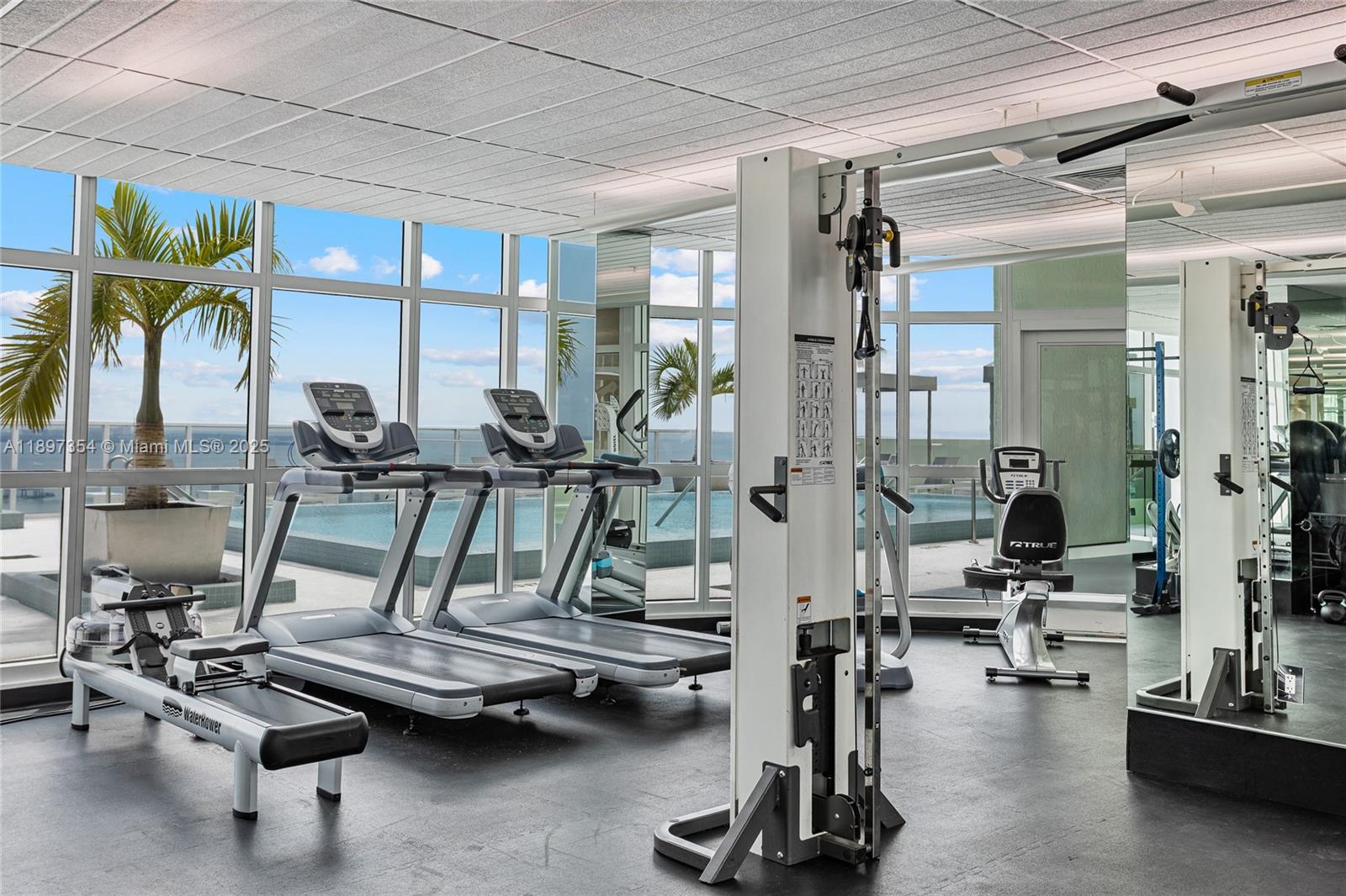 218 Southeast 14th Street, Unit 2105 Miami, FL 33131 - Photo 28 of 36 a view of a room with gym equipment