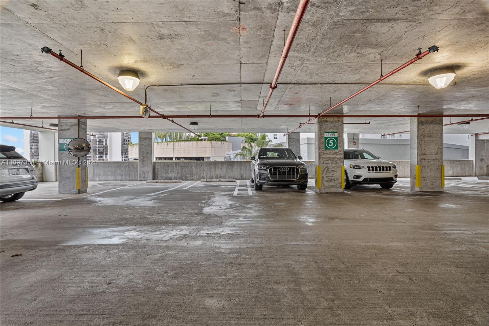 218 Southeast 14th Street, Unit 2105 Miami, FL 33131 - Photo 29 of 36 a view of parking space with parked cars