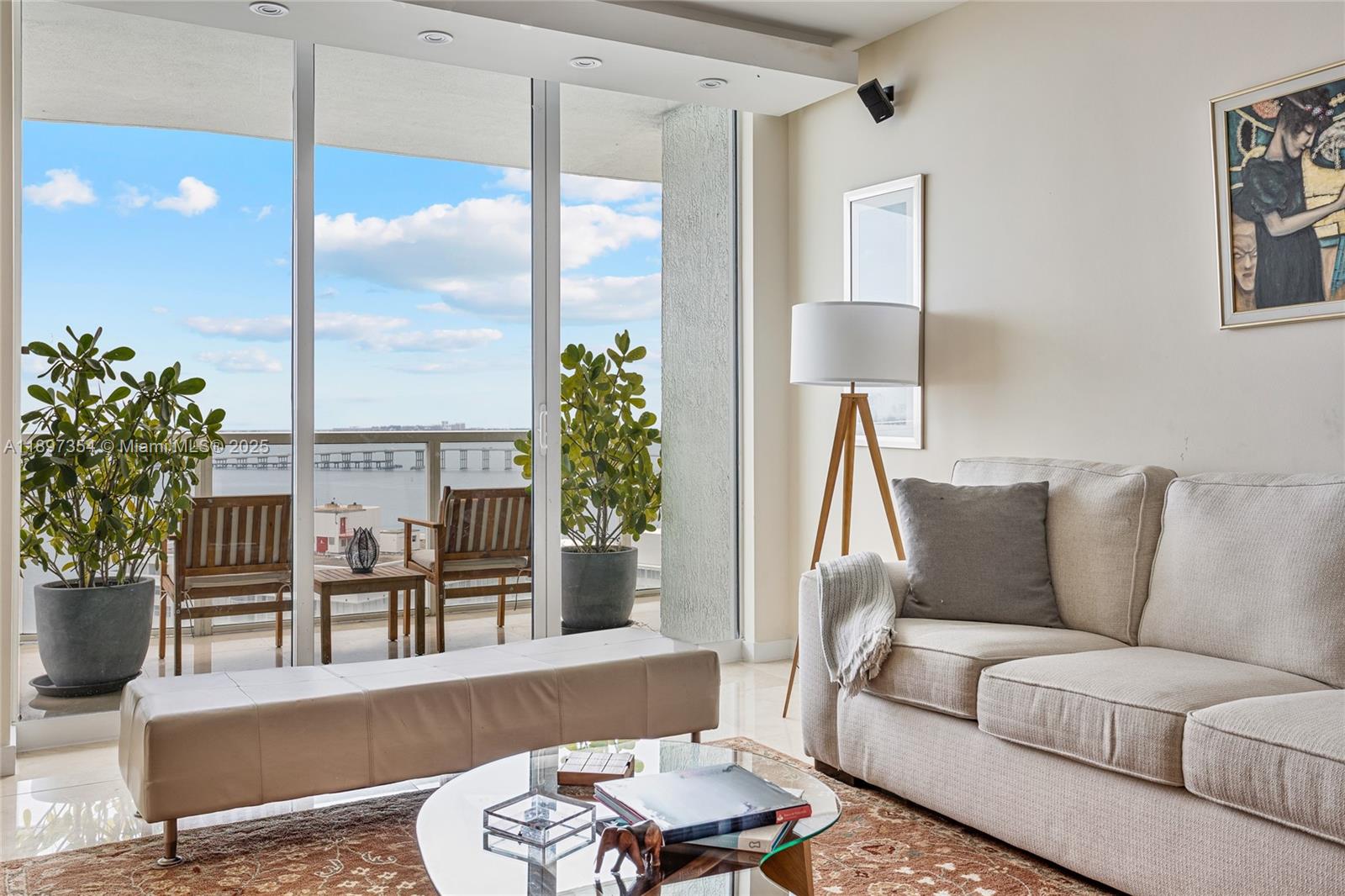 218 Southeast 14th Street, Unit 2105 Miami, FL 33131 - Photo 3 of 36 a living room with furniture and a large window