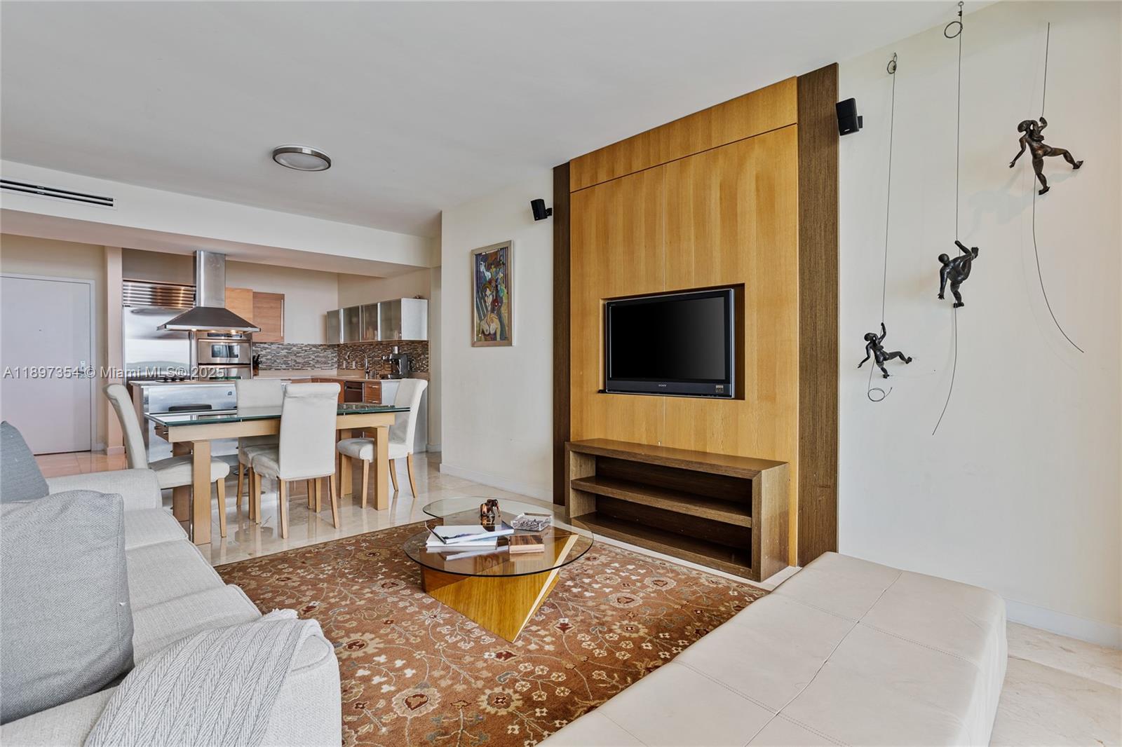 218 Southeast 14th Street, Unit 2105 Miami, FL 33131 - Photo 6 of 36 a living room with furniture and a flat screen tv