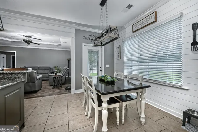 a dinning table and chairs in a patio