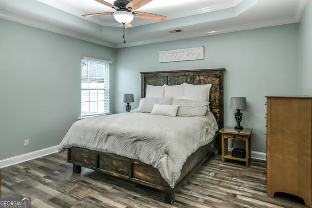 a bedroom with a bed and window