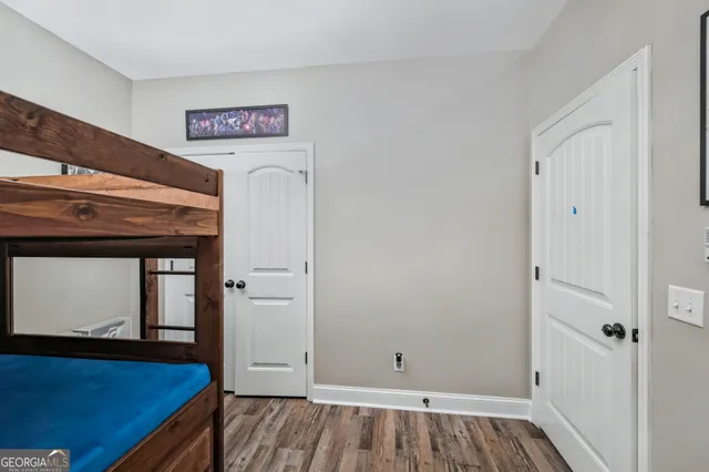 a view of livingroom with hallway and wooden floor