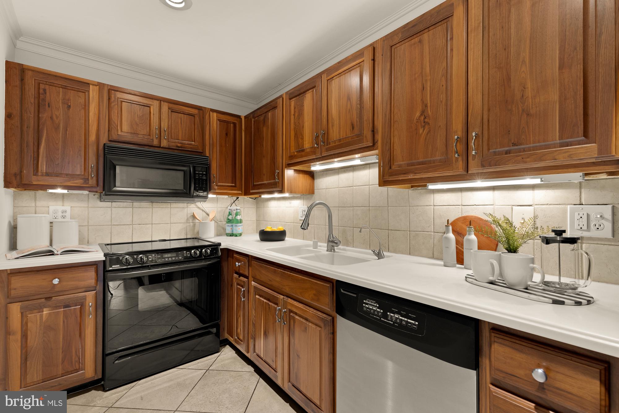 6 Logan Circle Northwest, Unit 2 Washington, DC 20005 - Photo 11 of 27 a kitchen with stainless steel appliances granite countertop a sink stove and cabinets