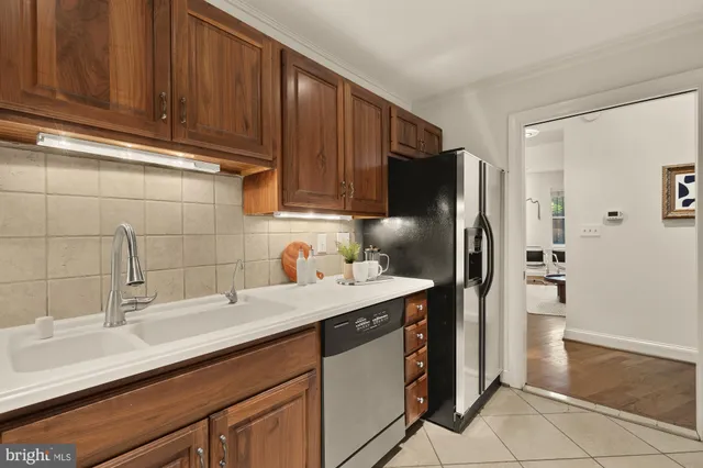 a kitchen with a sink and refrigerator