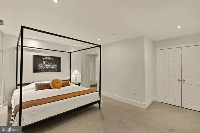 a bedroom with bed and a window