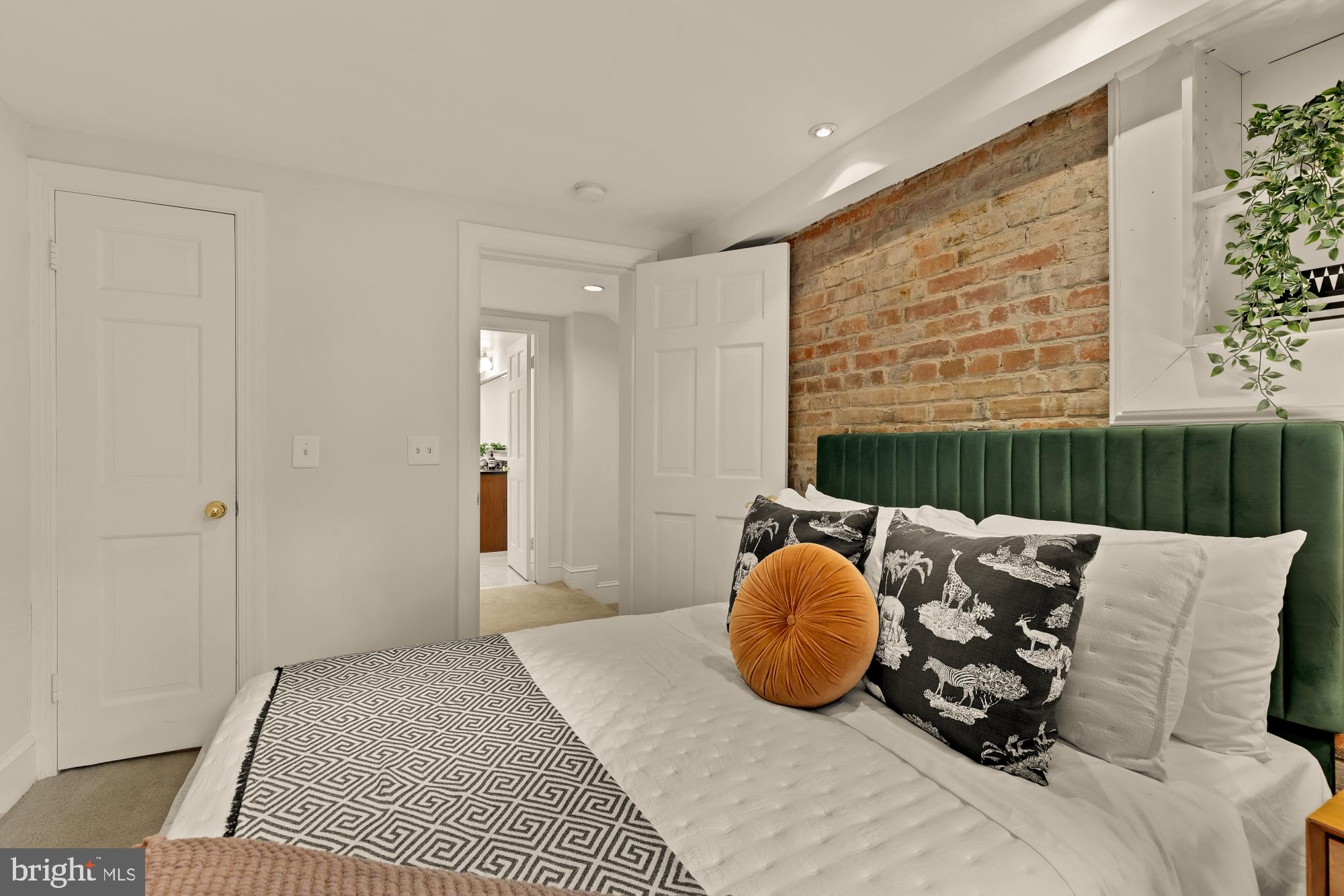 6 Logan Circle Northwest, Unit 2 Washington, DC 20005 - Photo 16 of 27 a bedroom with furniture and a window