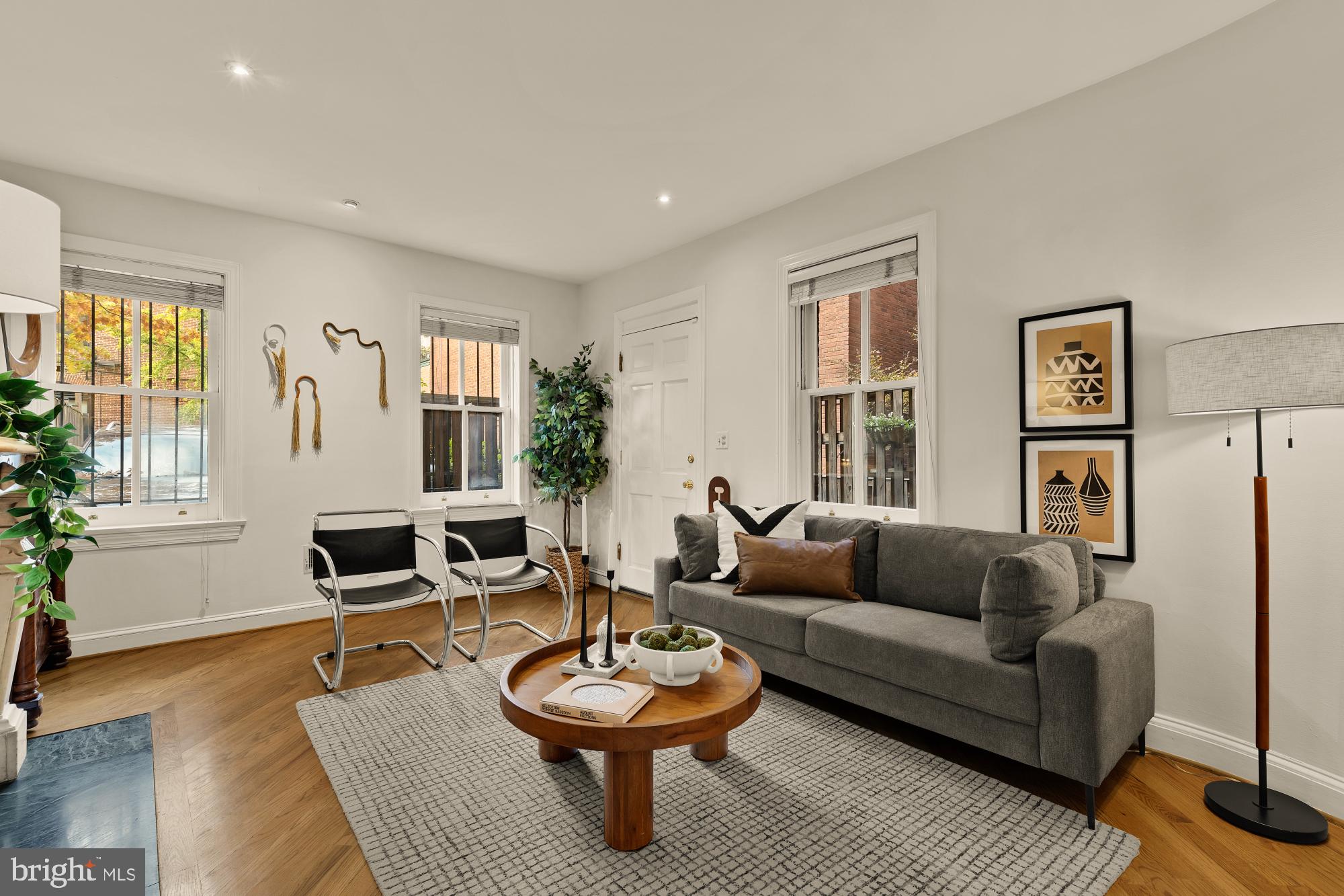 6 Logan Circle Northwest, Unit 2 Washington, DC 20005 - Photo 2 of 27 a living room with furniture and a wooden floor