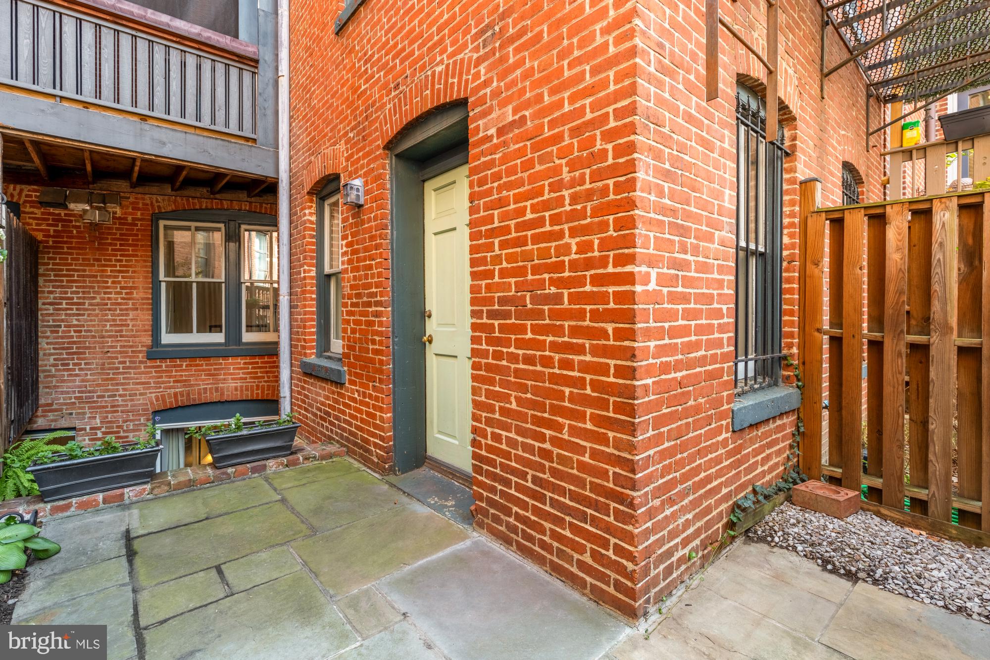 6 Logan Circle Northwest, Unit 2 Washington, DC 20005 - Photo 25 of 27 a view of a brick house with many windows
