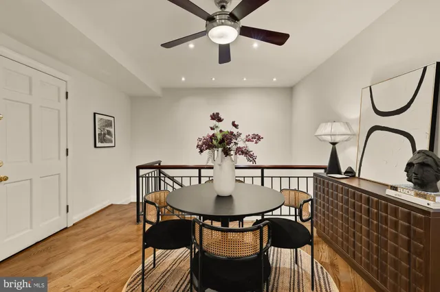 a view of a dining room with furniture and wooden floor