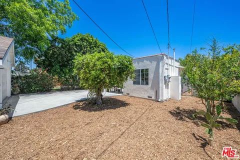 a view of a backyard of the house
